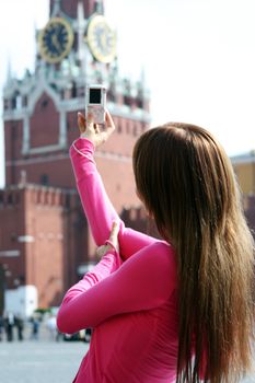 Young woman photographed attractions in Moscow