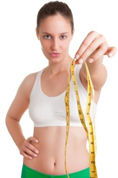 Woman holding a measuring tape in front of her