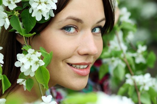 Portrait of beautiful woman in spring blossom