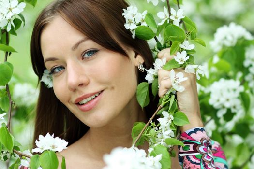 Portrait of beautiful woman in spring blossom