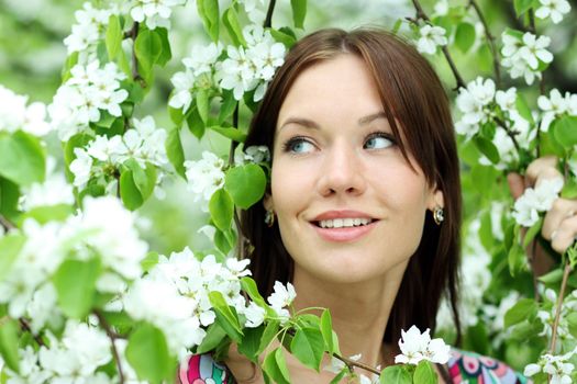 Portrait of beautiful woman in spring blossom