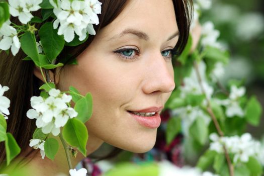 Portrait of beautiful woman in spring blossom