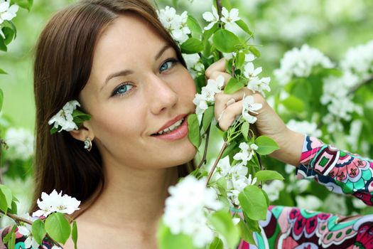 Portrait of beautiful woman in spring blossom