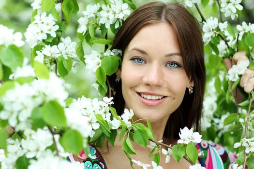 Portrait of beautiful woman in spring blossom