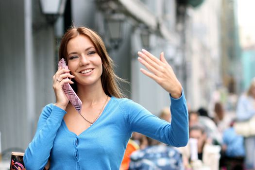 Young woman calling by phone