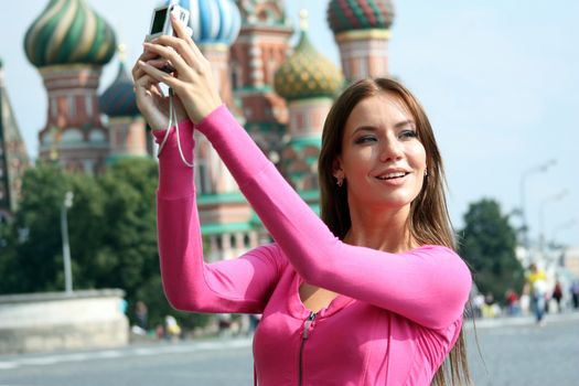 Young woman photographed attractions in Moscow