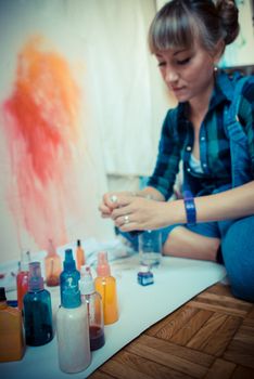 beautiful blonde woman painter in her studio