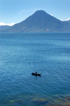  Volcanic Atitlan Lake in Guatemala with a small boat