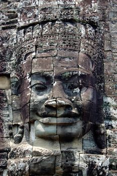Cambodian gray rock sculpture in angkor wat, bayon