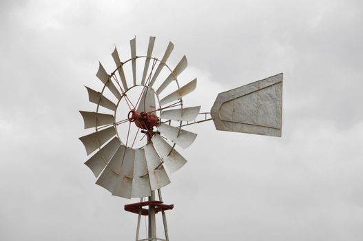 Metal windmill on a cloudy sky, in Canary Islands, Spain