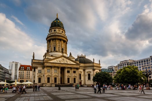 BERLIN, GERMANY - AUGUST 10: German Cathedral and Gendarmenmarkt Square on August 10, 2013 in Berlin, Germany. The square was created by Johann Arnold Nering at the end of the seventeenth century.