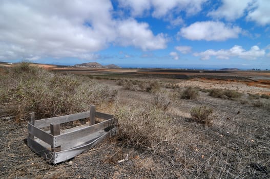 Old wooden abandoned box in the desert , in Lanzarote, spain