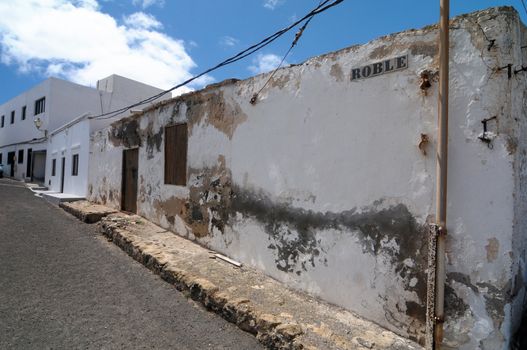 Old aged wall near a street, in Lanzarote, Spain