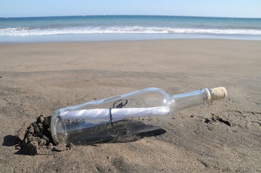 Message in a bottle on a lonely beach ,in Tenerife, Spain