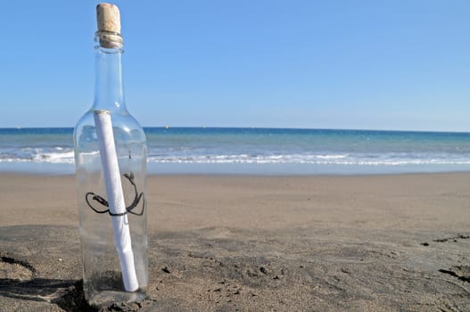 Message in a bottle on a lonely beach ,in Tenerife, Spain