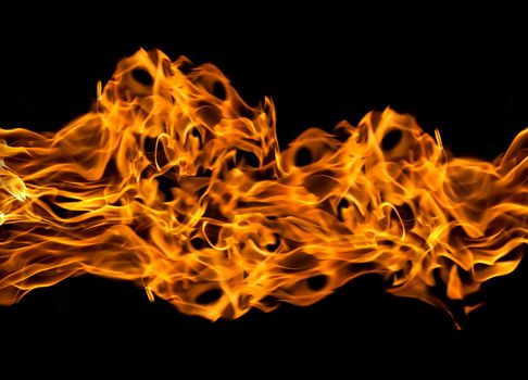 Orange fire flames on a black background