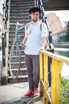 hipster young man on bike in the city