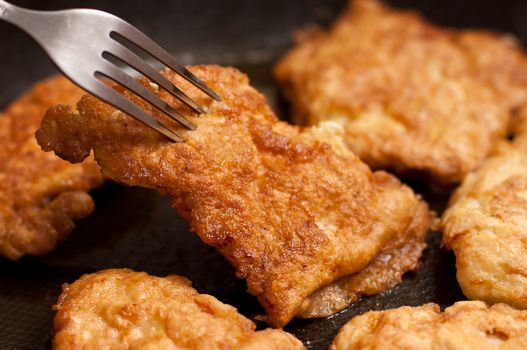 Ready fried chicken chops on griddle
