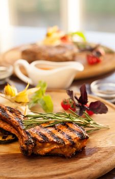 Grilled meat with rosemary, basil and vegetables