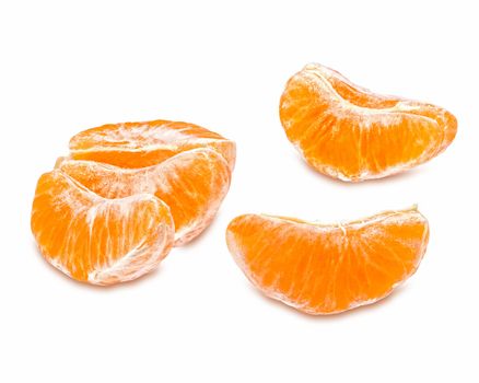 Slices of juicy tangerine isolated on white background