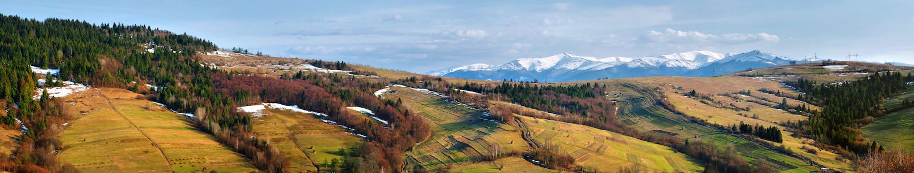 Panorama of snow-capped peaks of Carpathian Mountains