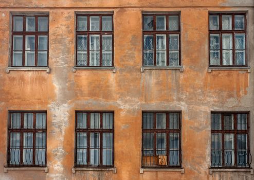 Old damaged wall with windows