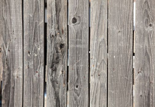 Close up of old gray wooden fence panels