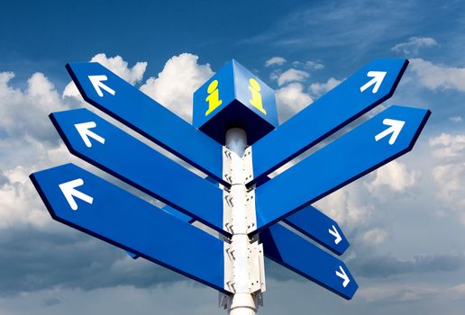 Blank directional road signs over cloudy sky