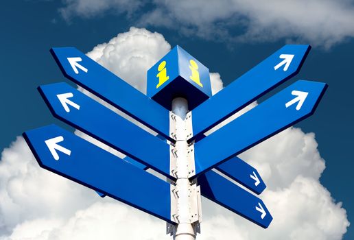 Blank directional road signs over cloudy sky