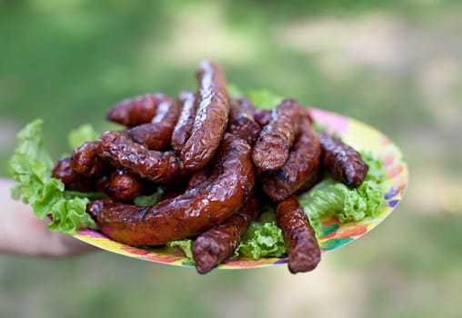 Juicy grilled sausages on the plate

 
