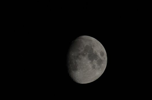 Half moon in the night on a black background