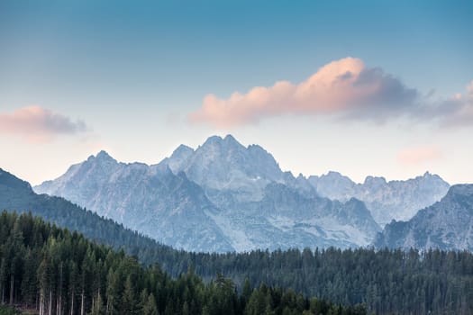 Pink cloud over the mountains in High Tatras National Park.. Strbske pleso, Slovakia, Europe