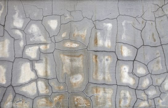 Grunge background. Cracked old gray concrete wall