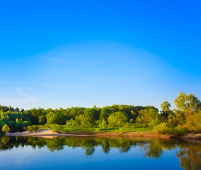 Summer Landscape With River And Blue Sky.