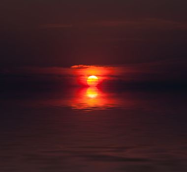 dramatic sunset and water reflection