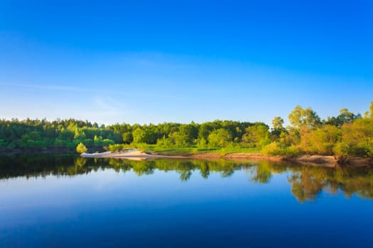 Summer Landscape With River And Blue Sky.