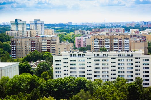 Buildings In A City In An Environment Of Green Trees