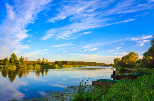 Sky And Clouds Reflection On Lake River