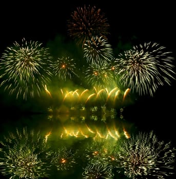 Fireworks (salute) and its reflection in water
