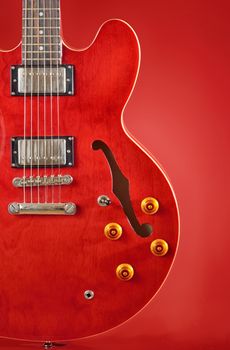 red guitar isolated on red