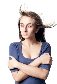 Portrait of a beautiful young woman with hair flying