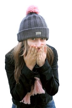 Girl trying to keep warm covering face with her hands