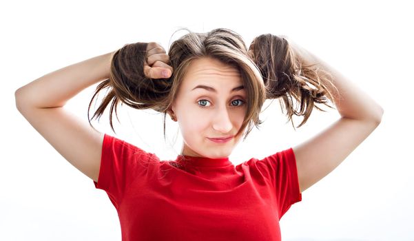 Young woman playing with her hair on white background