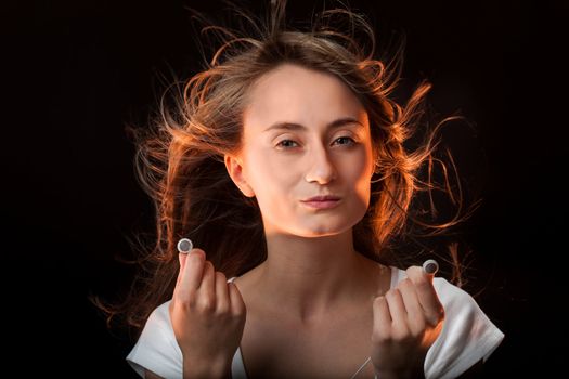 Beautiful Woman with headphones on dark background