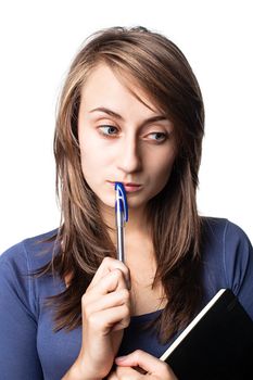 student with a pen and a notebook on a white background