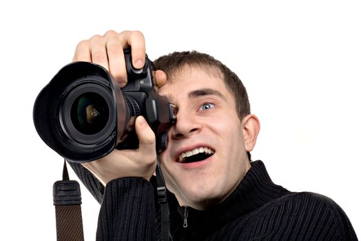 Surprised young photographer isolated on white background