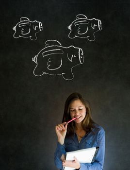 Businesswoman, student or teacher with chalk piggie banks  concept blackboard background