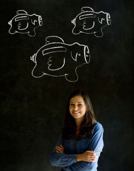 Businesswoman, student or teacher with chalk piggie banks  concept blackboard background
