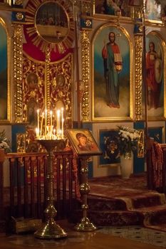 GOMEL - MAY 4: Interior Of Belarusian Orthodox Church. Candles Under The Ancient Icon Framed With The Gold On May 4, 2013 In Gomel, Belarus