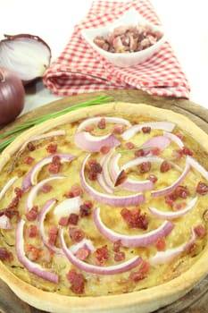 freshly baked onion tart with ham cubes